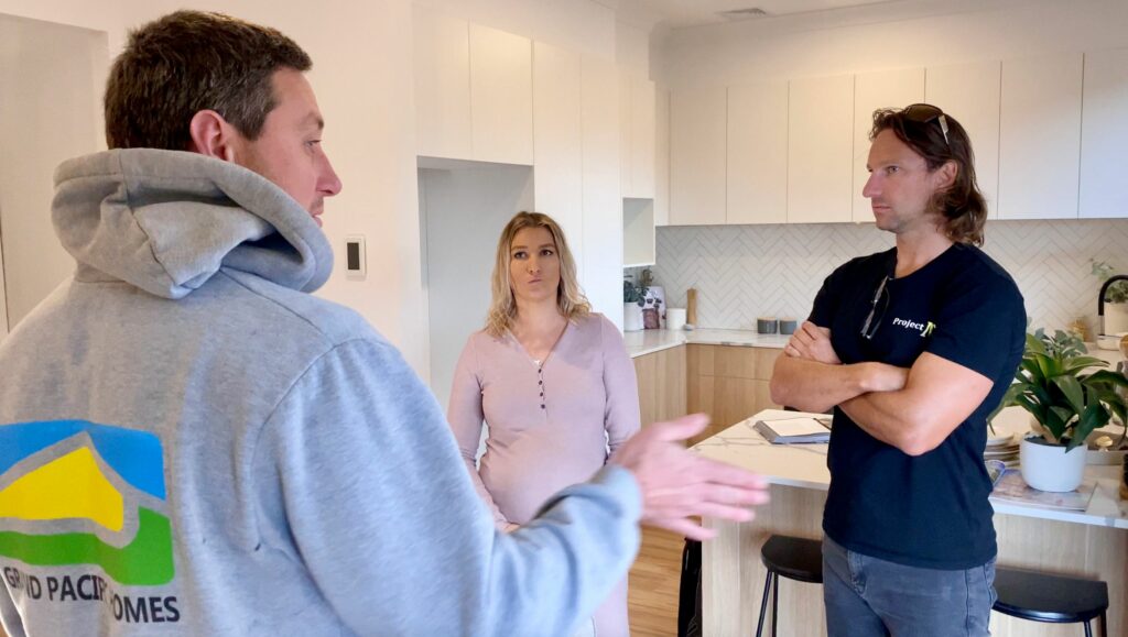 People standing and talking in the Kitchen